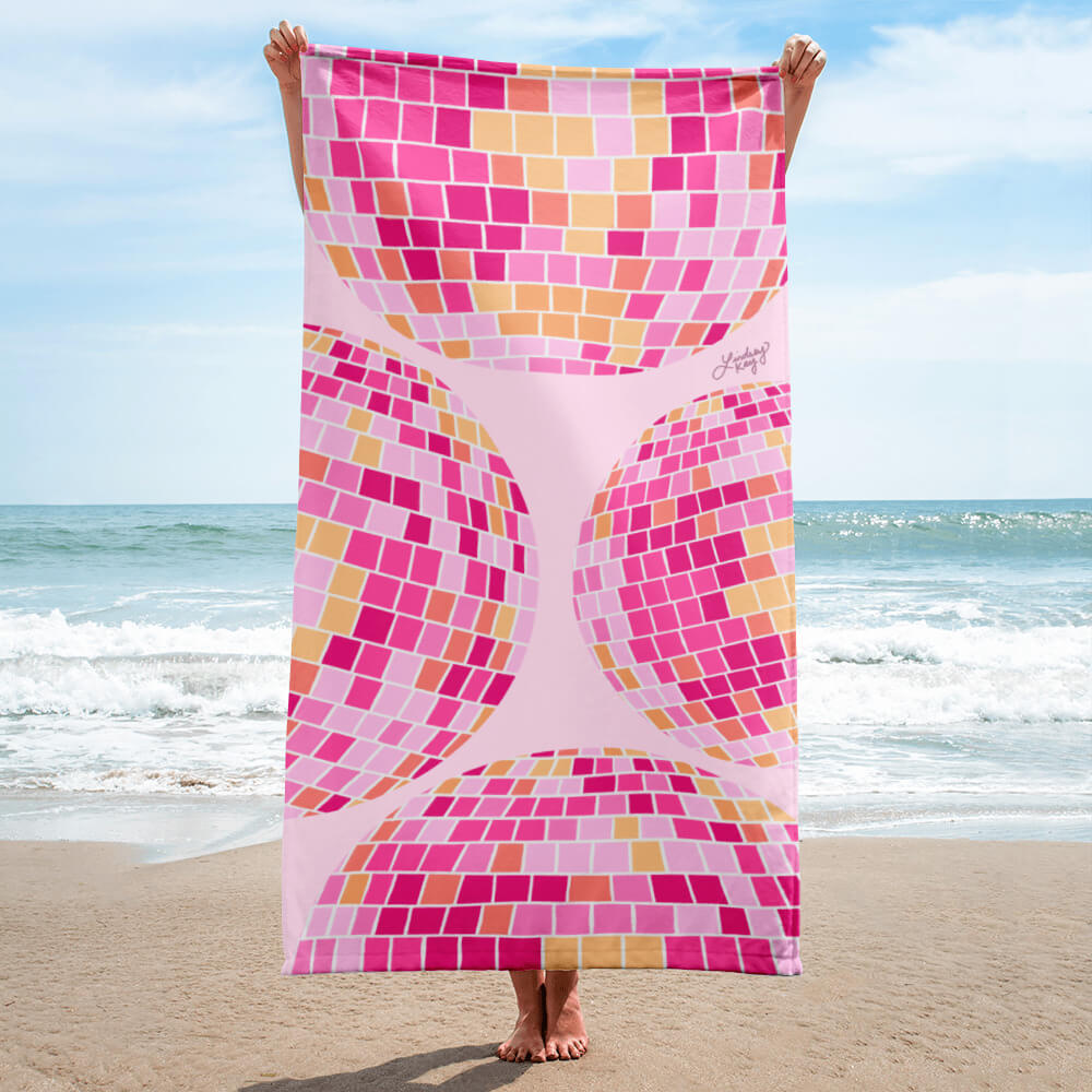 Retro pink, yellow, and orange disco ball beach towel with hand-drawn design by Lindsey Kay Collective. Groovy towel for summer beach days, bachelorette parties, poolside lounging, and colorful retro aesthetic. 30x60 cotton polyester summer towel.