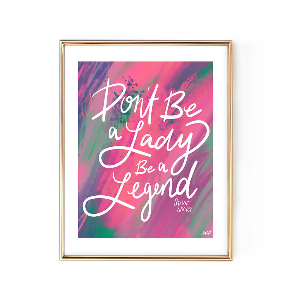 Hand-lettered Stevie Nicks quote art print Don’t Be a Lady Be a Legend by Lindsey Kay Collective – empowering inspirational wall art – available in gold/white, pink, pastel purple/green, and black/purple color palettes – perfect for female empowerment gifts, office decor, dorm rooms, or gallery walls – printed on enhanced matte paper with vibrant inks – available in 10 sizes