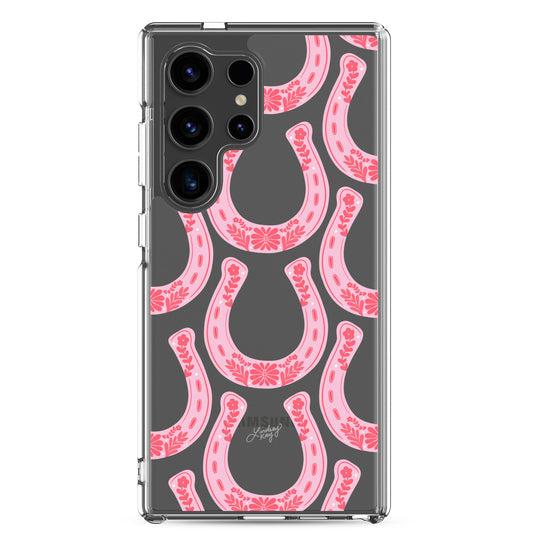 Clear durable Samsung phone case with a pink floral western horseshoe pattern, perfect for any trendy cowgirl. Original design by Lindsey Kay Collective.