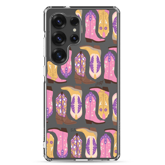 Samsung clear phone case with hand-illustrated pink, yellow, and brown cowgirl boots. Durable and protective design, available in all Samsung sizes. Perfect for western girlies, country lovers, and bold, colorful personalities.
