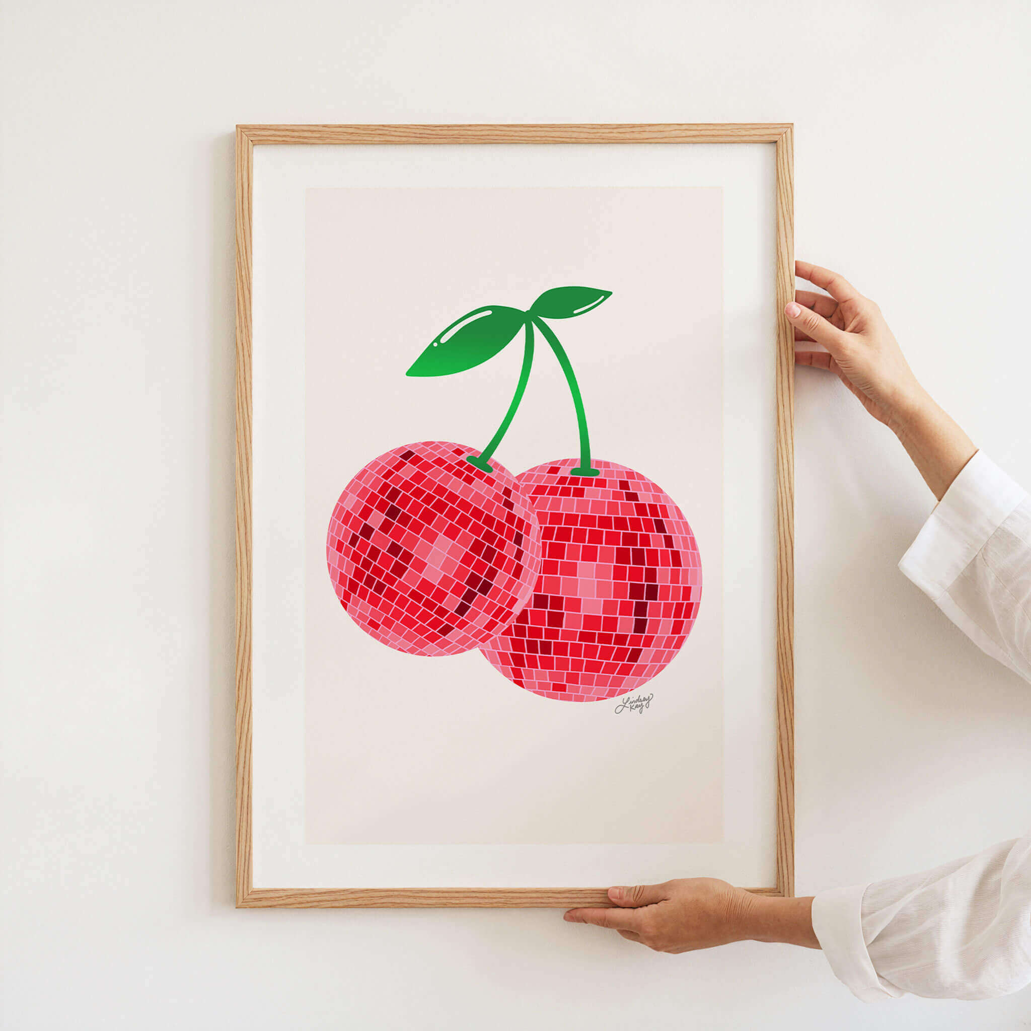 Hand-drawn retro disco ball cherries art print by Lindsey Kay Collective – available in red or pink color palettes – vibrant bar cart, dorm room, or gallery wall decor – retro colorful wall art – printed on enhanced matte paper with bright inks – available in 10 sizes