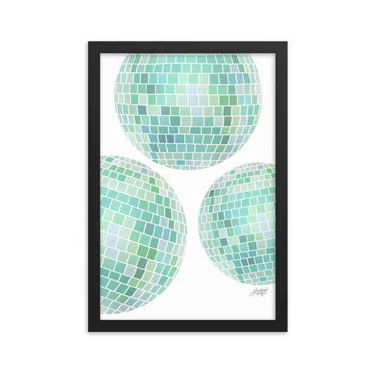Framed hand-illustrated retro disco ball art print in vibrant green colors on matte paper, available in white, black, or brown wood frame, 70s-inspired wall decor.