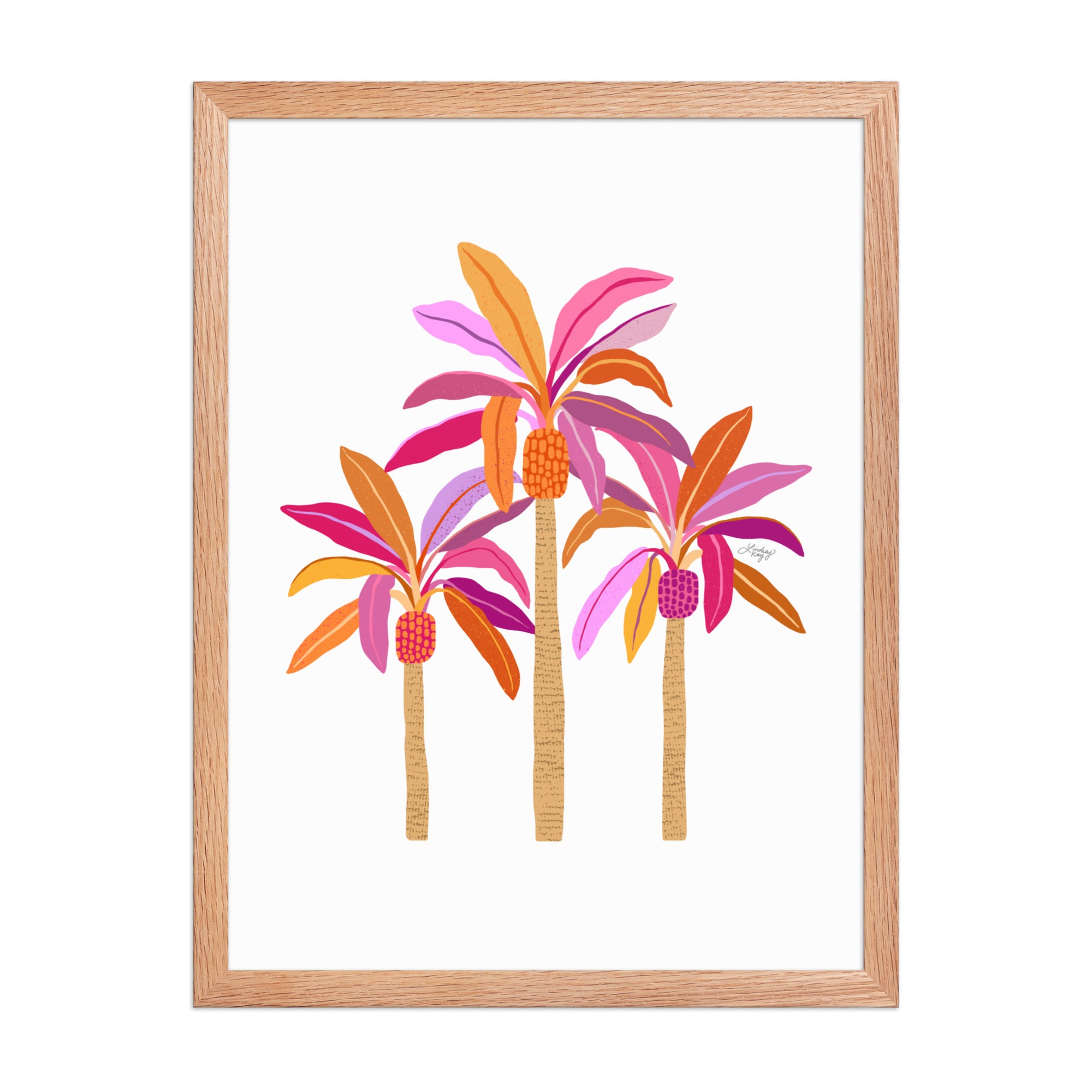 Framed hand-illustrated palm tree art print in pink, purple, and orange on matte paper, available in white, black, or brown wood frame, tropical sunset wall decor.