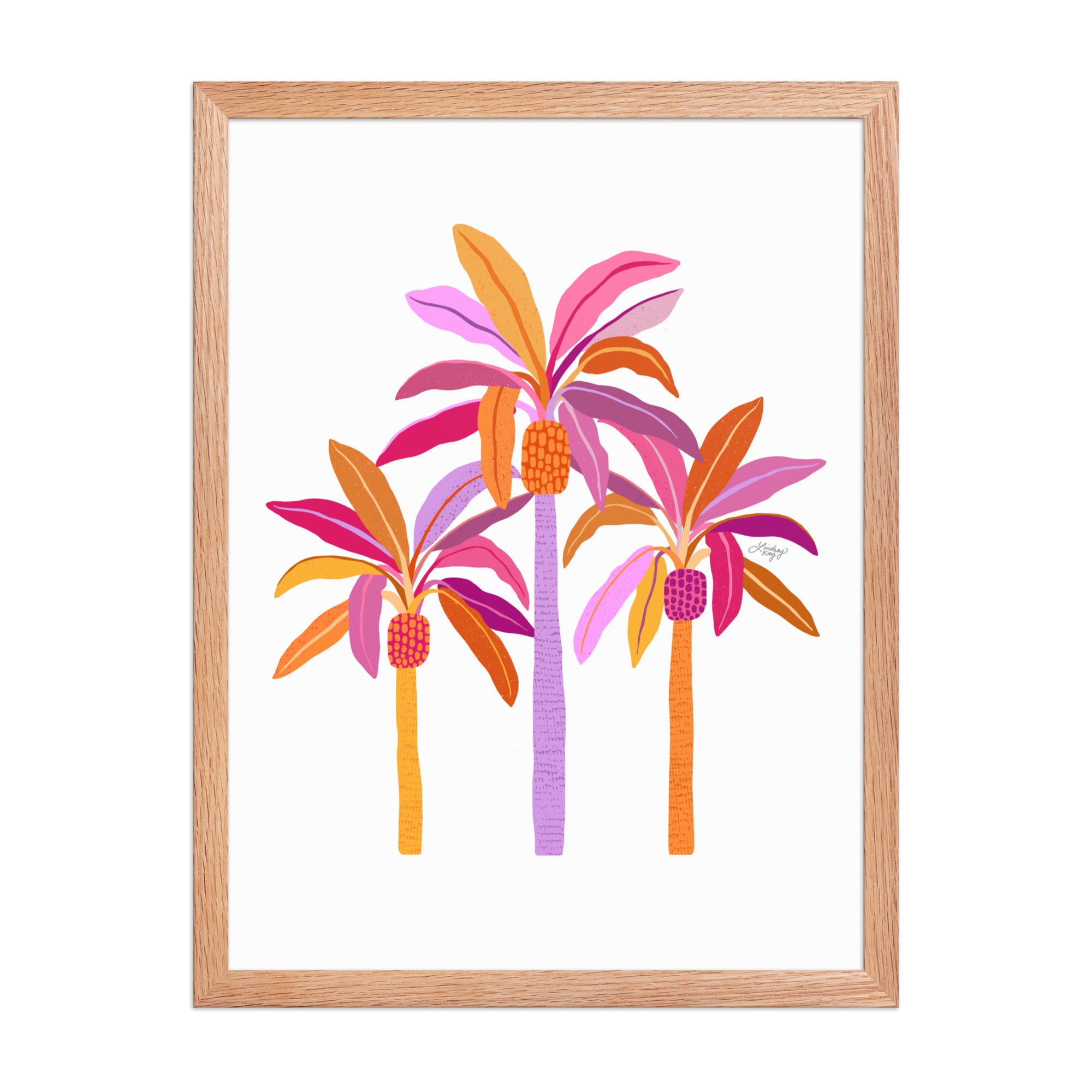 Framed hand-illustrated palm tree art print in pink, purple, and orange on matte paper, available in white, black, or brown wood frame, tropical sunset wall decor.