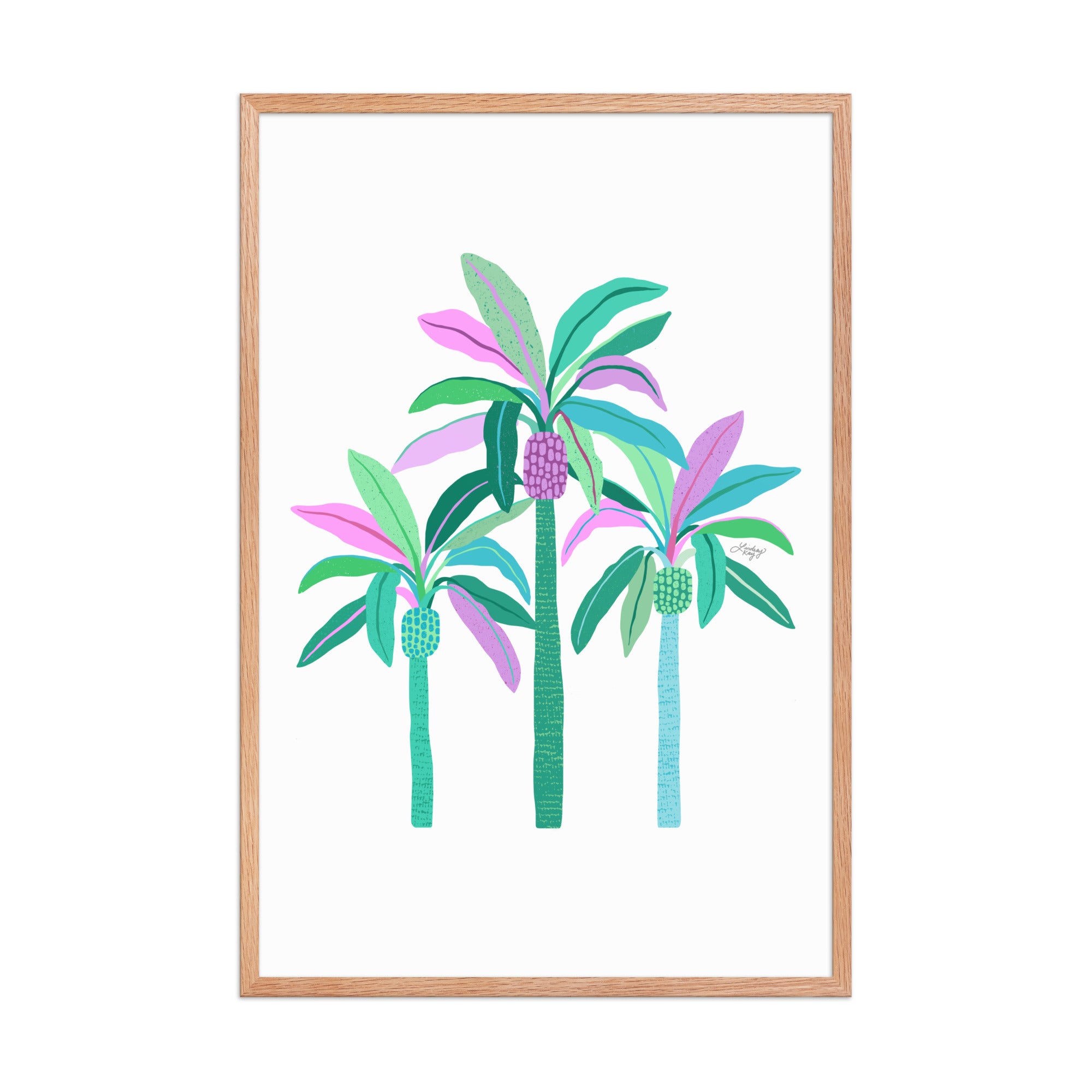 Framed hand-illustrated palm tree art print in green, purple, and blue on matte paper, available in white, black, or brown wood frame, tropical sunset wall decor.