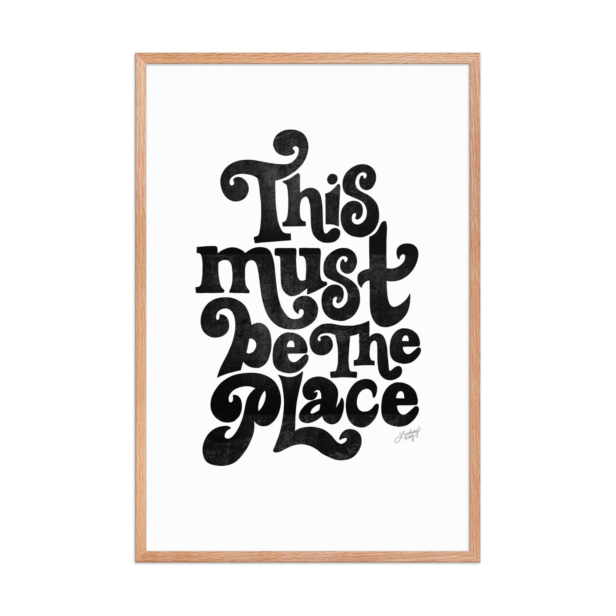 Framed matte art print with hand-lettered quote “This Must Be The Place” in vibrant colors, Lindsey Kay Collective wall art, gallery wall decor