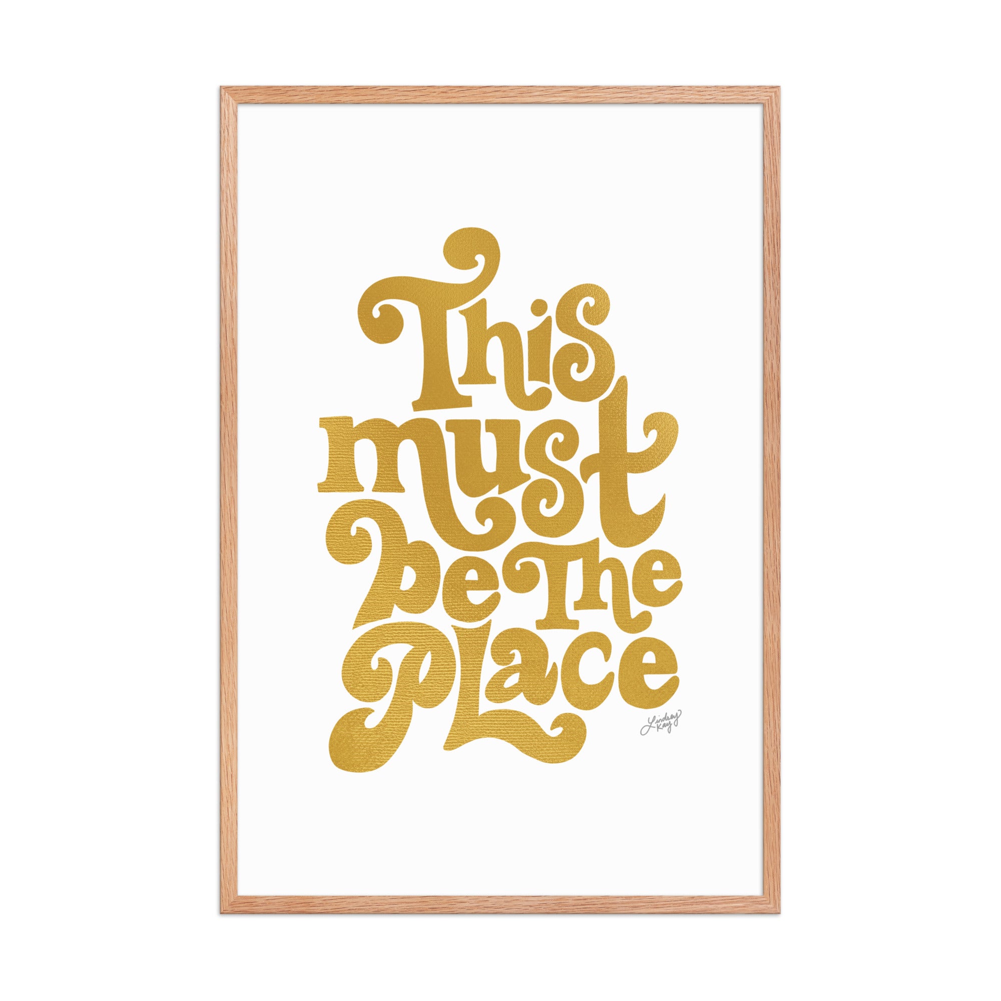 Framed matte art print with hand-lettered quote “This Must Be The Place” in vibrant colors, Lindsey Kay Collective wall art, gallery wall decor