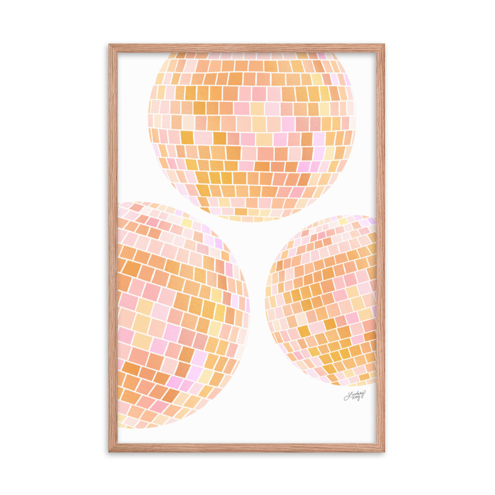 Framed hand-illustrated retro disco ball art print in vibrant yellow colors on matte paper, available in white, black, or brown wood frame, 70s-inspired wall decor.