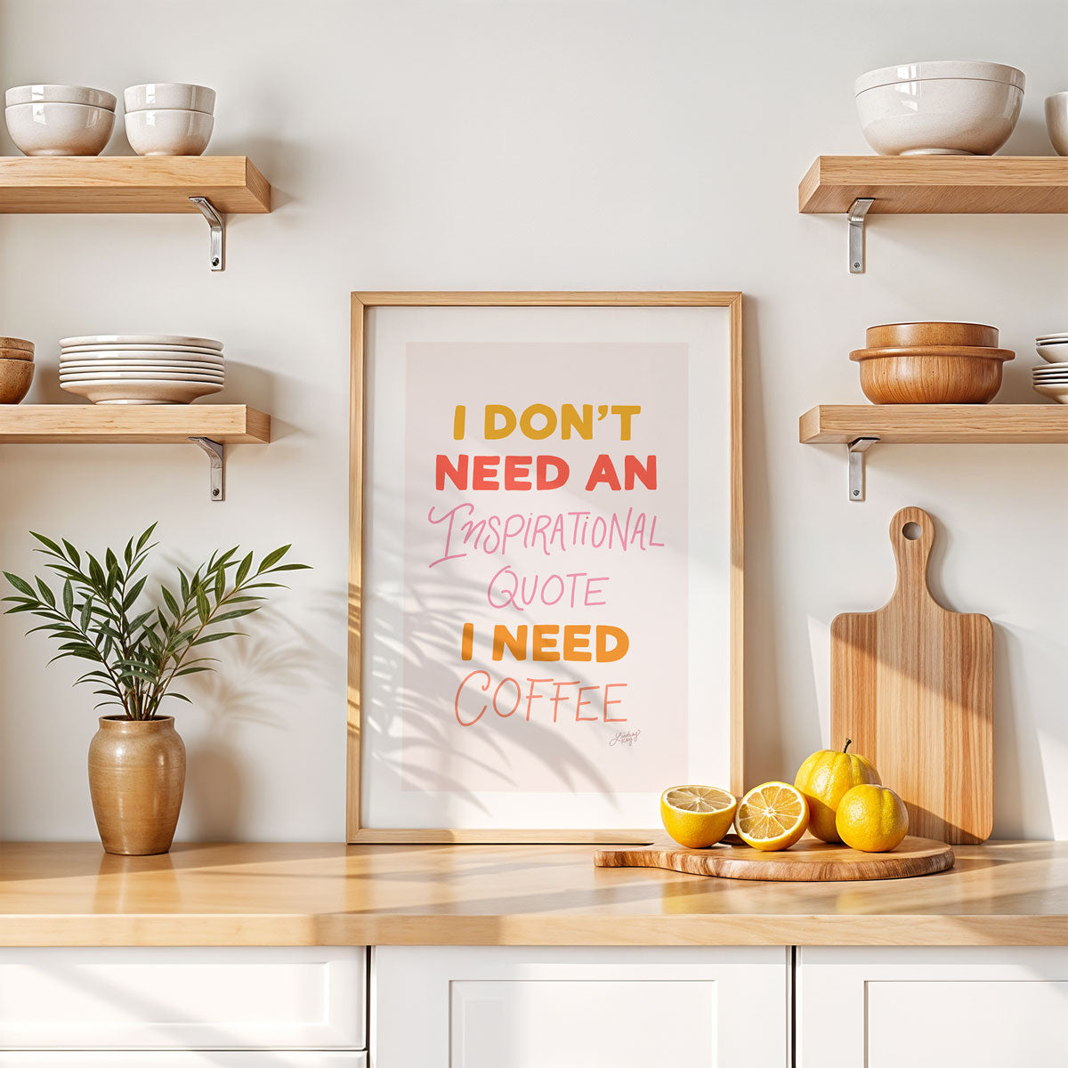 Hand-lettered art print that says 'I don’t need an inspirational quote I just need coffee,' perfect for kitchen or office decor