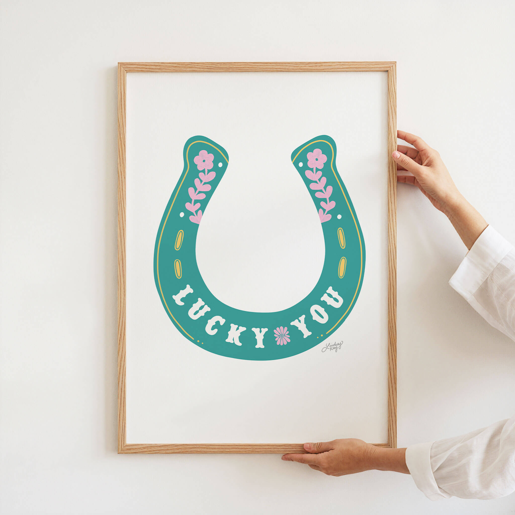 Hand-illustrated floral horseshoe Lucky You art print by Lindsey Kay Collective – western cowgirl wall art for sorority rooms, gallery walls, or boho western decor – available in turquoise, pink, and gold – printed on enhanced matte paper with vibrant inks – available in 10 sizes