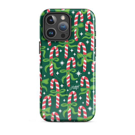 Hand-drawn festive candy cane iPhone case with ribbons in bright greens, pinks, and reds. Holiday phone case for girly, festive style. Available in Clear, Tough, MagSafe Clear, and MagSafe Tough for iPhone 11–17. Hand-illustrated by Lindsey Kay Collective — female-owned small business, no AI used.