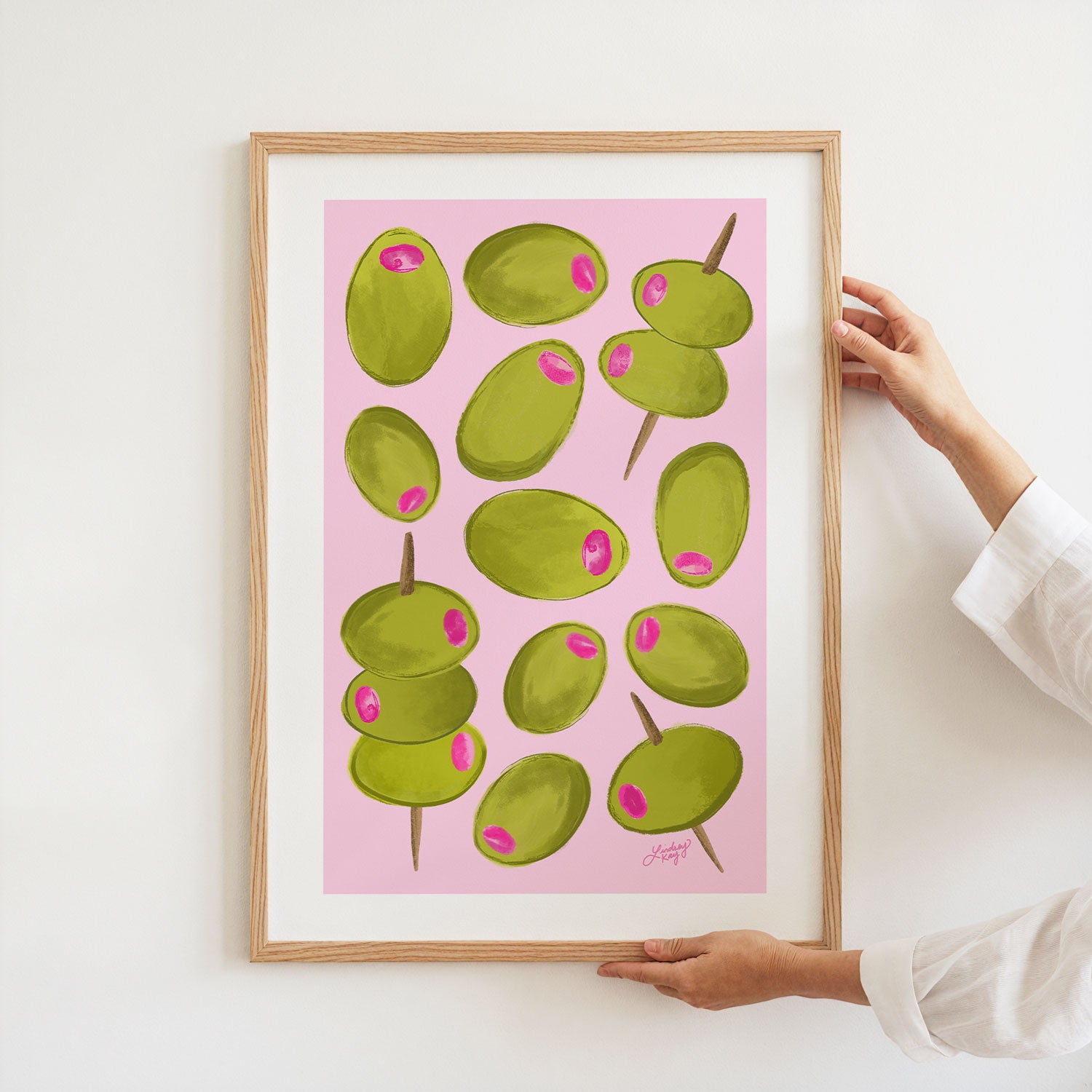 Hand-illustrated green and pink olives art print by Lindsey Kay Collective, perfect for kitchen wall decor, bar cart styling, or gifts for olive lovers. Available in multiple sizes, printed on premium matte paper.