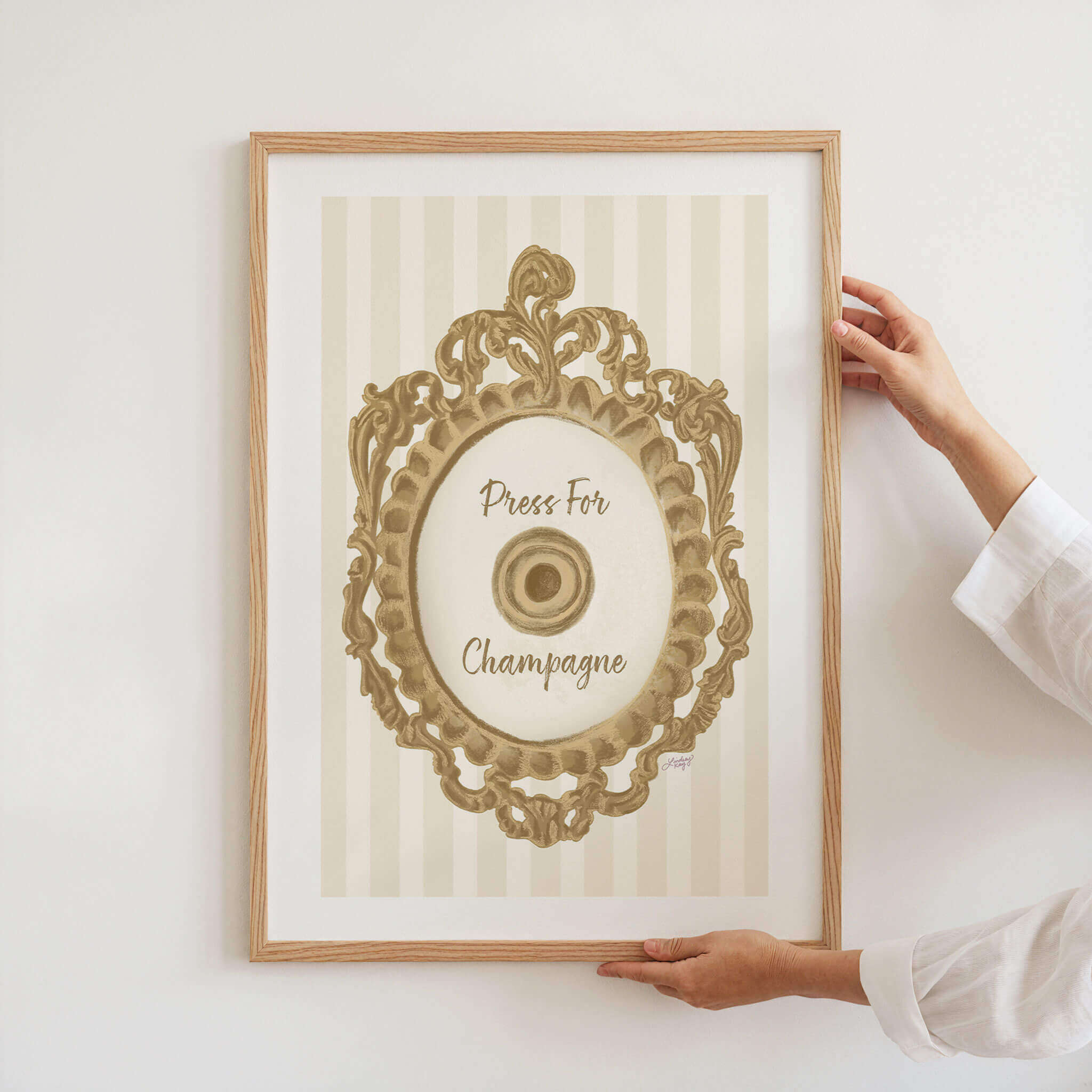 Hand-illustrated Press for Champagne art print by Lindsey Kay Collective – coquette girly wall decor inspired by the iconic button design – available in gold/white, pink/white, and pink/gold color palettes – perfect for dorm rooms, bar carts, or gallery walls – printed on enhanced matte paper with vibrant inks – available in 10 sizes