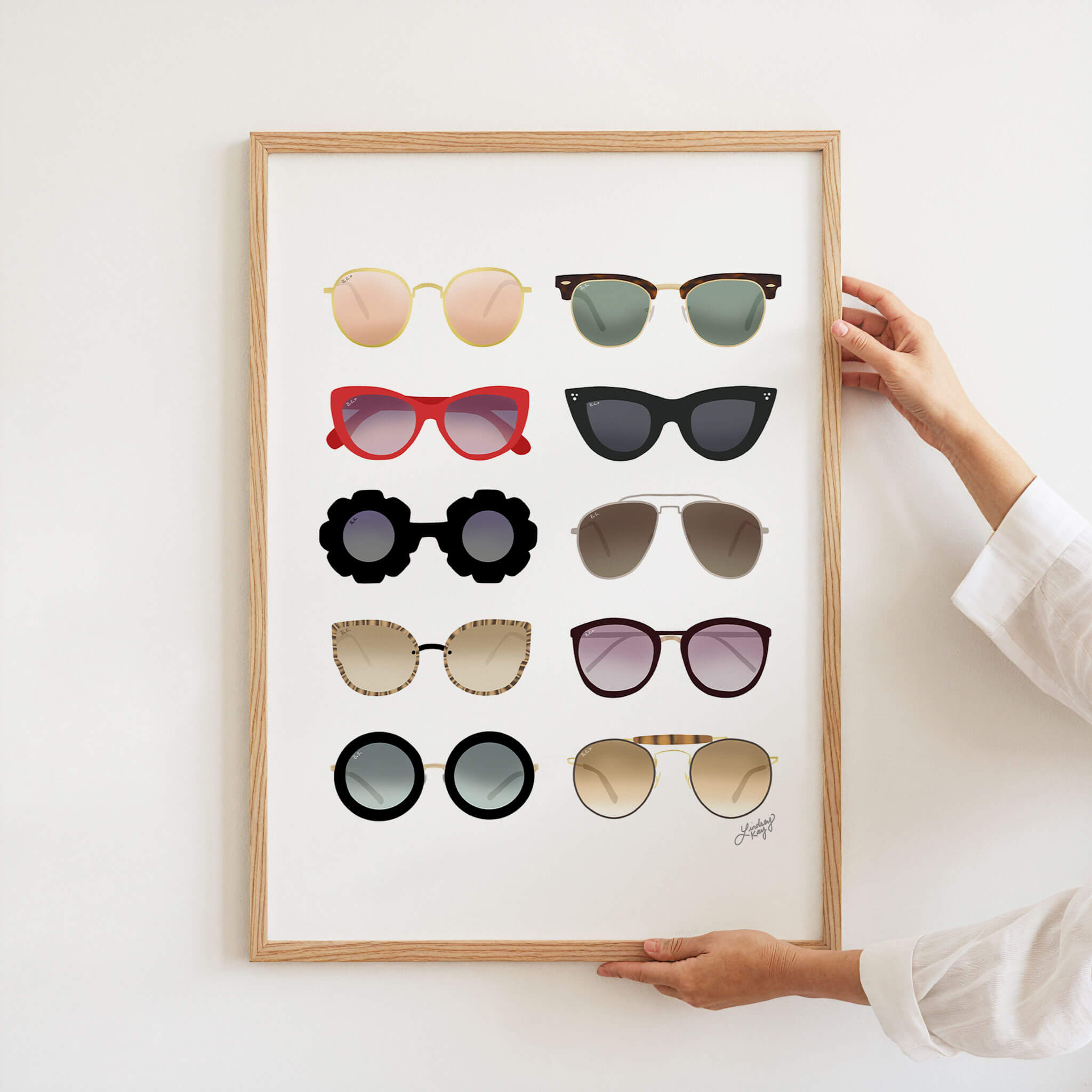 Art print featuring hand-illustrated retro sunglasses, combining playful colors and vintage flair for a bold, trendy wall decor statement. Created by Lindsey Kay Collective.