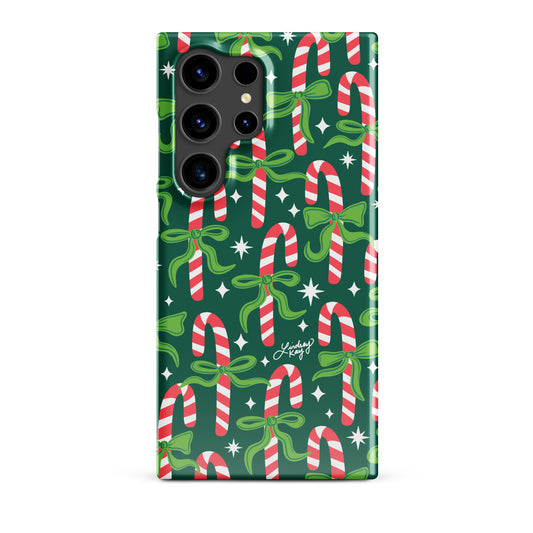 Hand-drawn festive candy cane Samsung case with ribbons in bright greens, pinks, and reds. Holiday phone case for girly, festive style. Available in Clear and Tough options for all Samsung Galaxy sizes. Hand-illustrated by Lindsey Kay Collective — female-owned small business, no AI used.