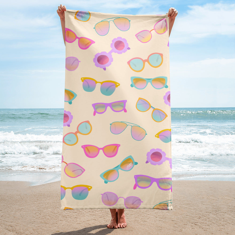 Patterned retro beach towel featuring pastel hand-drawn sunglasses, perfect for summer pool days or beach outings