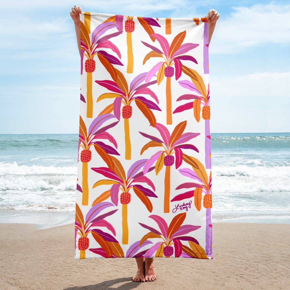 Pastel retro palm trees illustration on a colorful beach towel, fun summer accessory