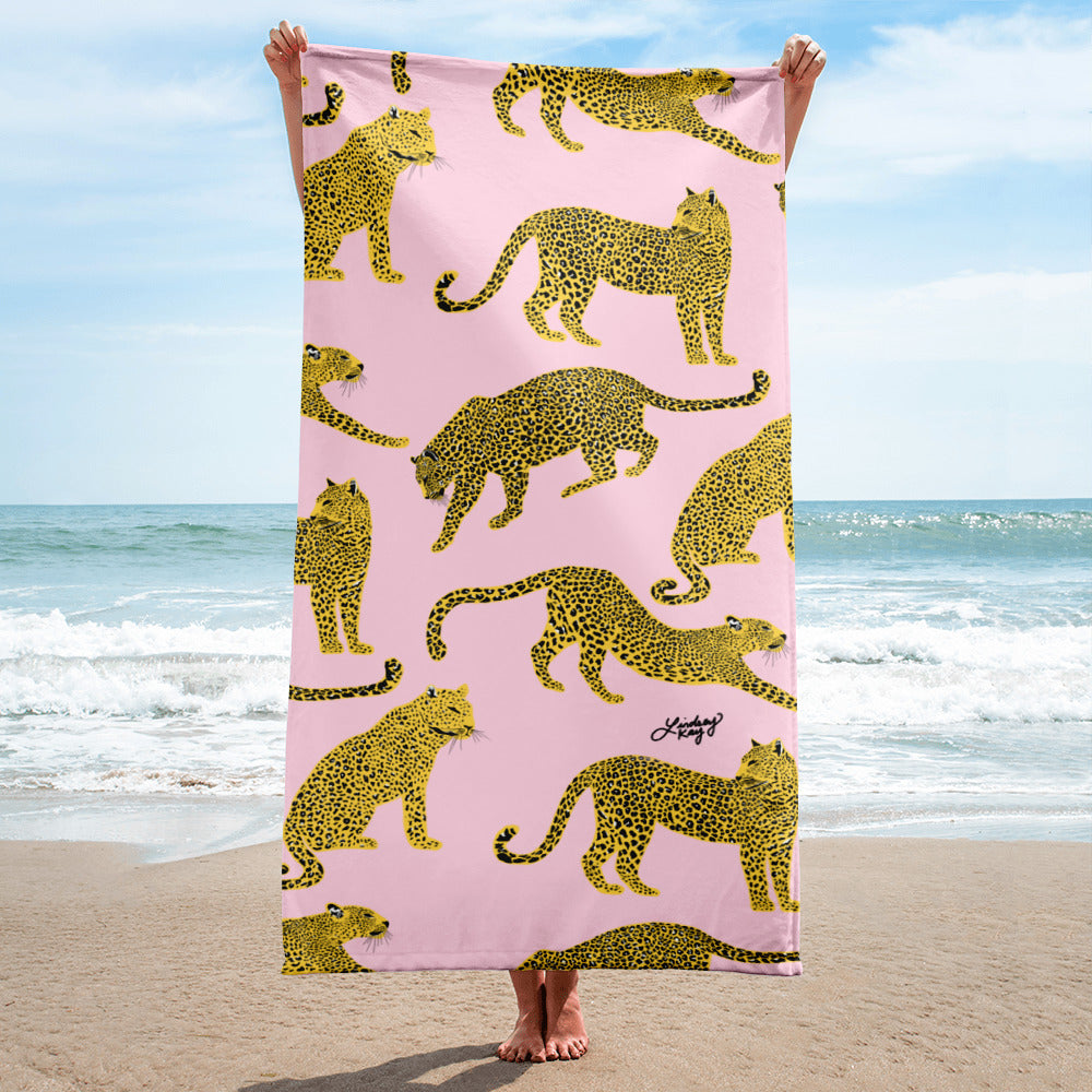 Pink and yellow leopards illustration on a colorful beach towel, fun summer accessory