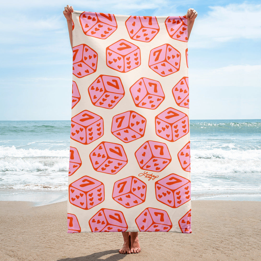 Pink lucky 7’s heart dice beach towel, perfect for a bachelorette party bridesmaid Vegas gift. 