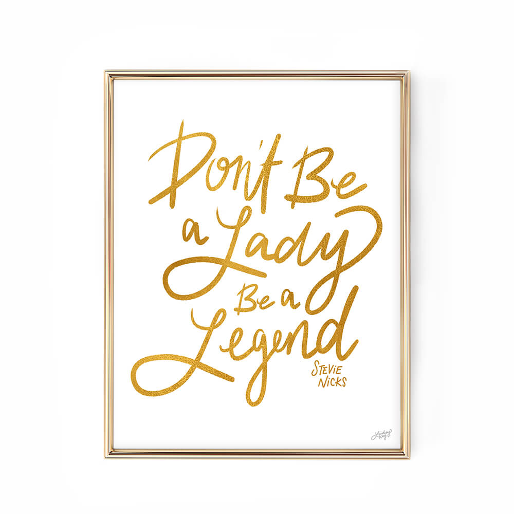 Hand-lettered art print with the quote Don’t be a lady, be a legend,” inspired by Stevie Nicks. Available in four bold colors, printed on matte paper. Perfect for boss babes, music lovers, and empowering home or office decor.