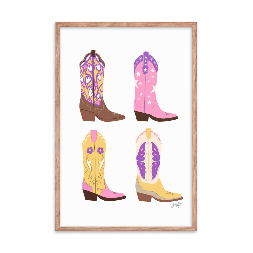 Framed hand-illustrated pastel cowgirl boots art print on matte paper, available in white, black, or brown wood frame, Western wall decor for rustic or boho spaces.