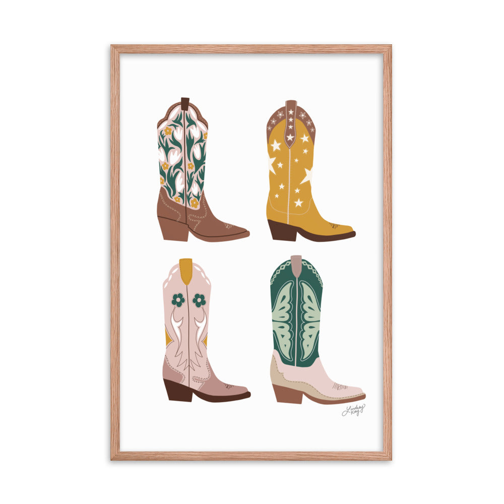 Framed hand-illustrated pastel cowgirl boots art print on matte paper, available in white, black, or brown wood frame, Western wall decor for rustic or boho spaces.