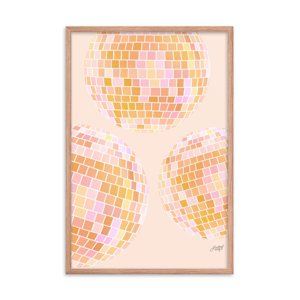 Framed hand-illustrated retro disco ball art print in vibrant yellow colors on matte paper, available in white, black, or brown wood frame, 70s-inspired wall decor.