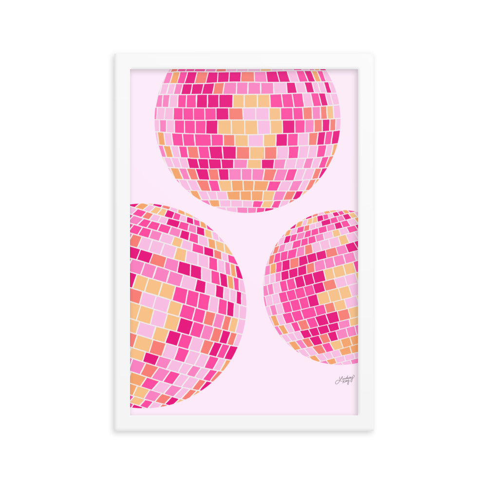 Framed hand-illustrated art print of three colorful disco balls on matte paper, available in white, brown, and black high-quality wood frames, retro wall decor.