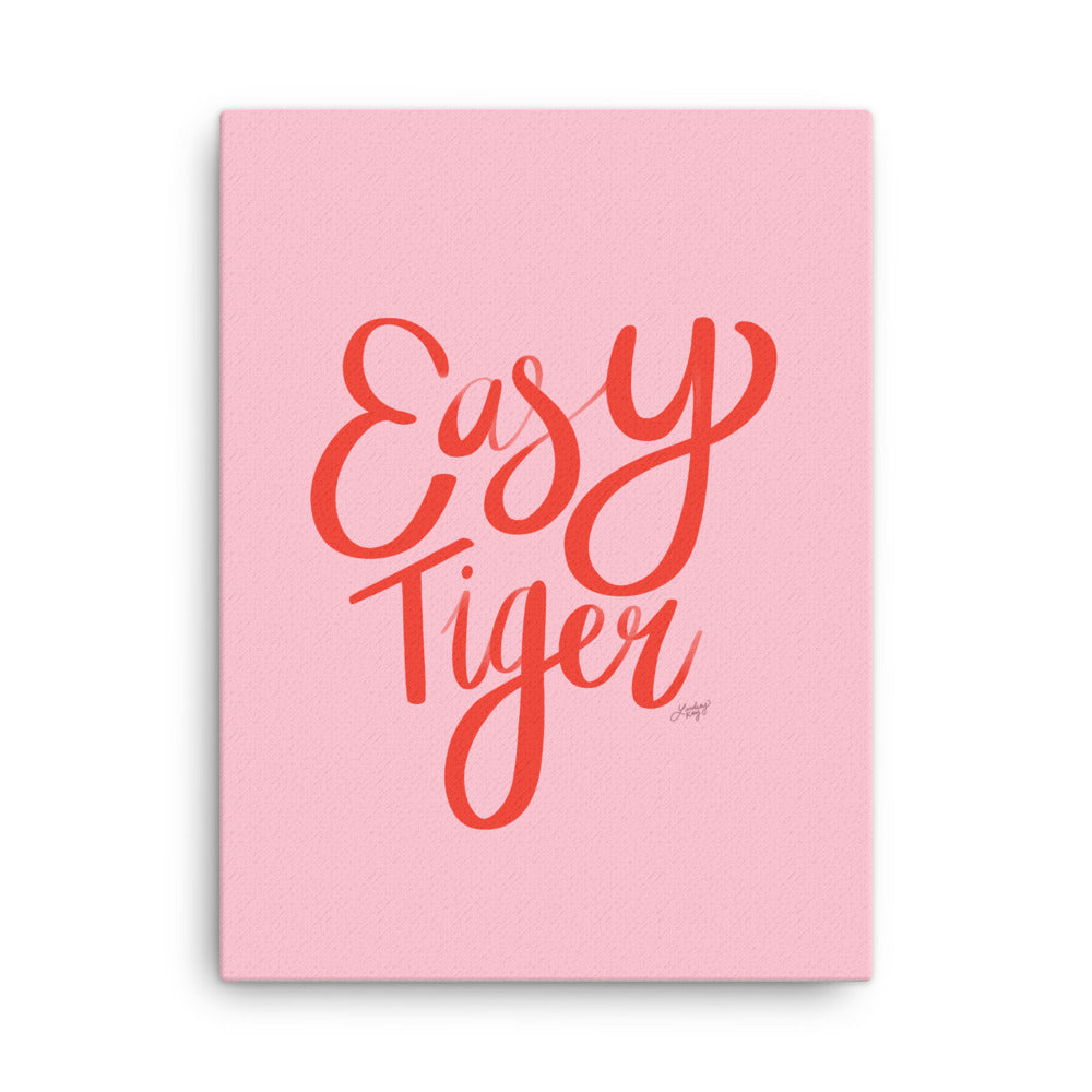 Hand-lettered pink and red illustration of the words easy tiger on canvas designed by lindsey kay collective